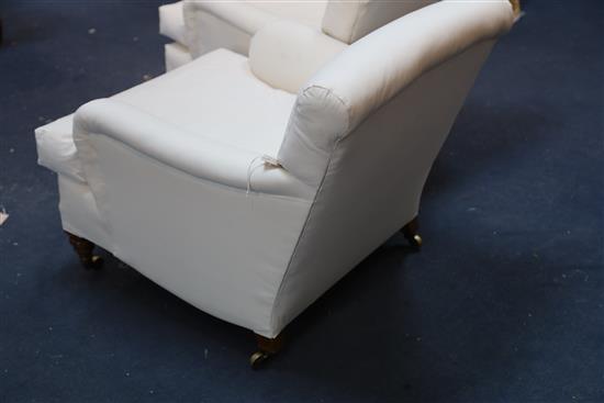 A pair of Victorian Howard & Sons club armchairs, W.2ft 6in. D.2ft 10in. H.2ft 5in.